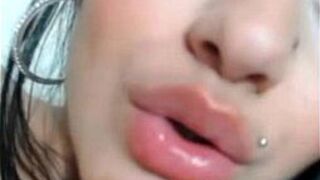 Tattooed babe presents her shaved pussy and ass - porn video